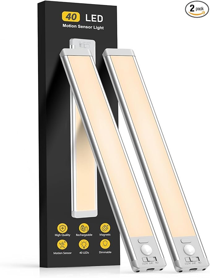 Rechargeable 10-inch under cabinet motion sensor lights installed under a kitchen counter, glowing warm white with modern minimal look. Home décor