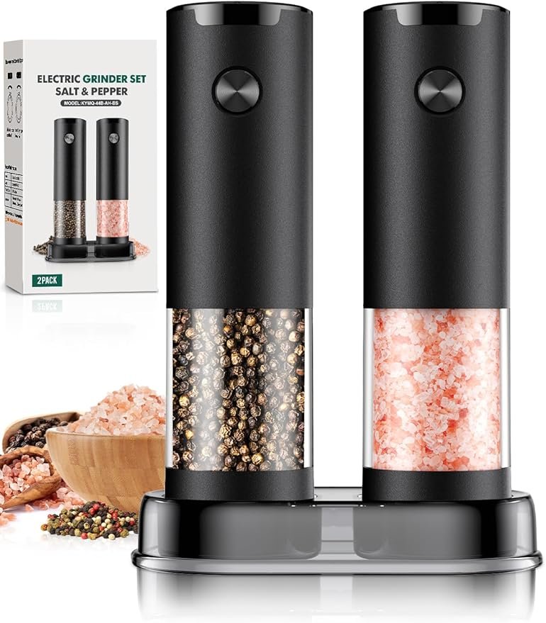 Sleek black electric salt and pepper grinders placed on a modern kitchen counter as part of a smart kitchen organizer setup.
