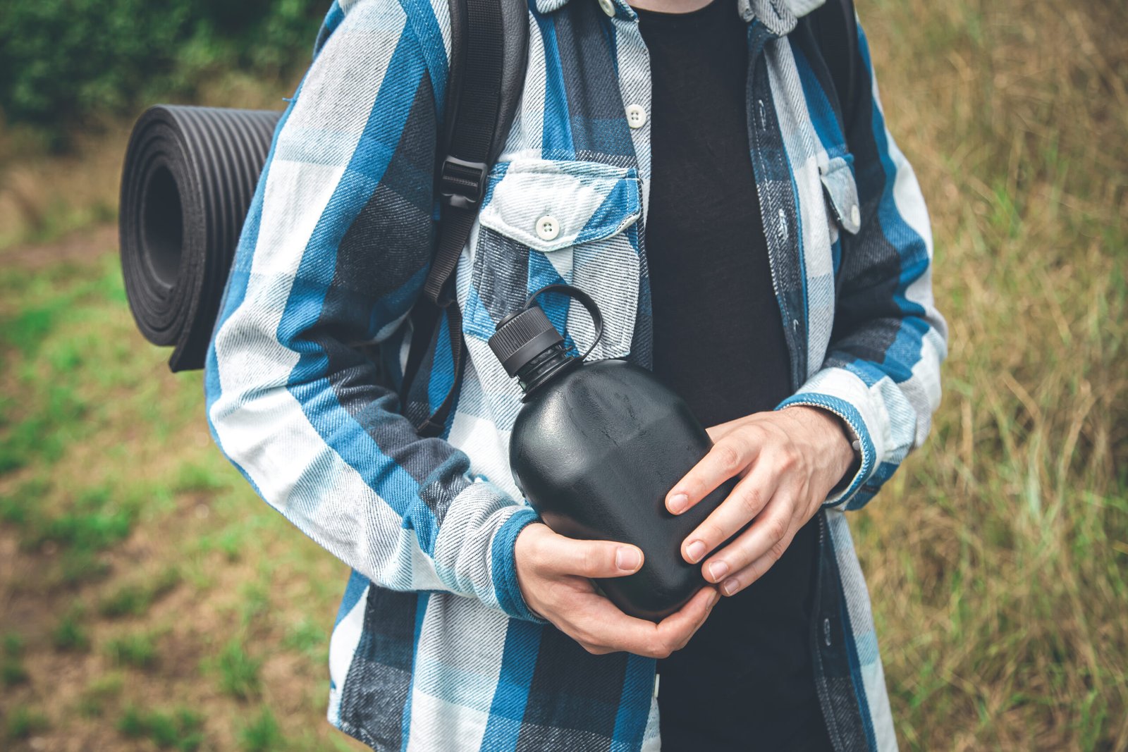 Iron Flask 40oz best insulated water bottle in Midnight Black with 3 leakproof lids.