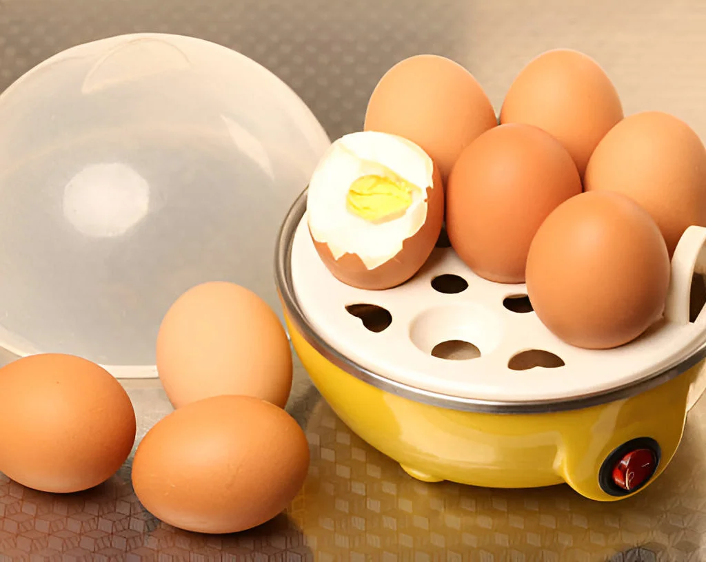 Elite Gourmet Easy Egg Cooker lets you cook up to 7 eggs quickly with auto shut-off. Includes poaching and omelet trays. Dishwasher safe and compact.