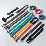 “WHATAFIT Resistance Bands set with multiple tension levels, detachable handles, ankle straps, and door anchor, colorful exercise bands for men and women strength training and home workouts, photographed on white background.”